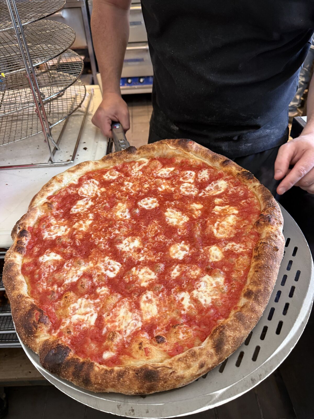 A fresh pizza straight out of the oven at Andy's Pizza